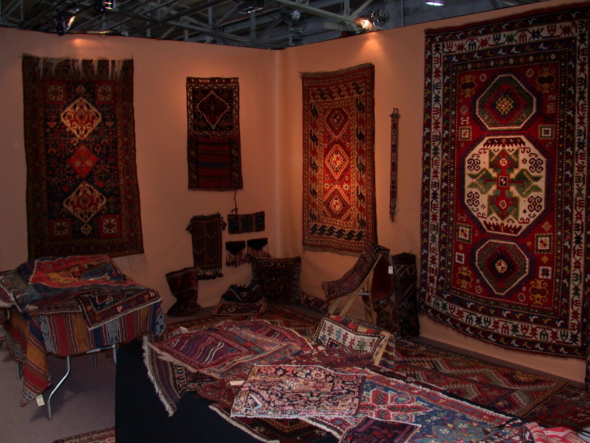 Antique rugs and weavings, some showing age and wear